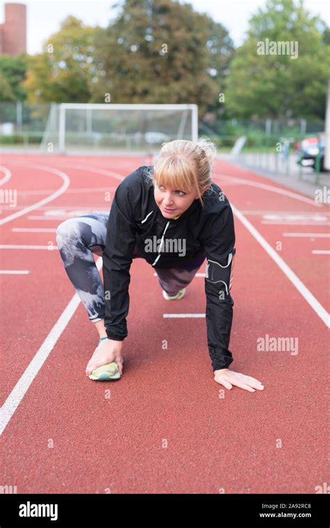 Woman On Running Track Stock Photo Alamy