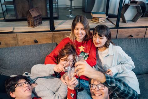 Group Friends Talking Sitting in a Couch in the Living Room Stock Photo ...