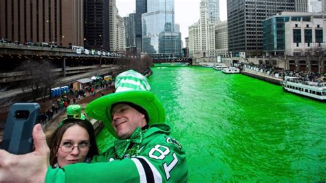 Thousands Of People On Saturday Lined The Banks Of The Chicago River