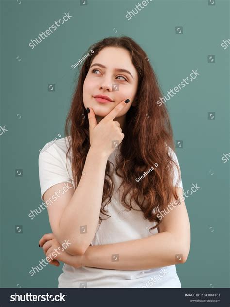 Young Girl Thoughtfully Smiles Looks Away Stock Photo 2143868181