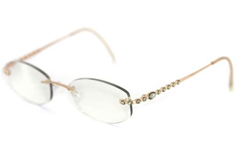 Daniel Swarovski S090 23 V6051 Brille Gold mit grünlichen Steinen