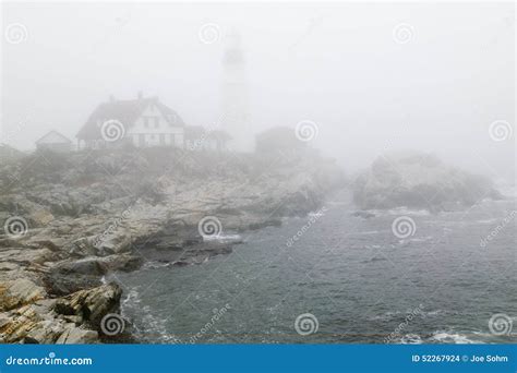 Fog Shrouds The Portland Head Lighthouse In Cape Elizabeth Maine Stock