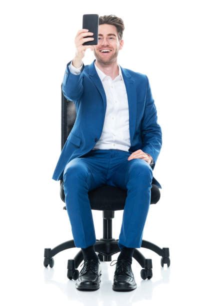 Smart Casual Man In Suit Sitting On Chair And Laughing Stock Photos