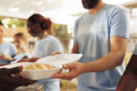 Free food served at a homeless shelter Stock Photo by DC_Studio | PhotoDune