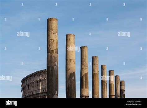 The Famous Pillars Of The Colosseum In Rome Italy Under A Clear Sky