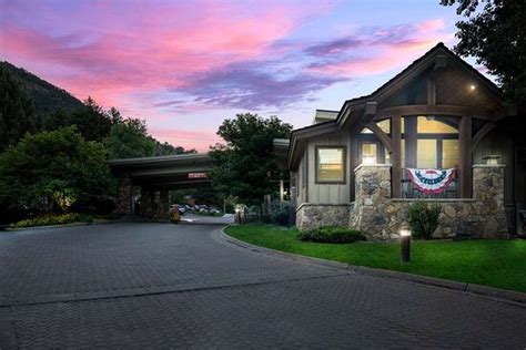 A Natural Setting With Big Trees Flowersgrassy Areas And Outdoor Pool