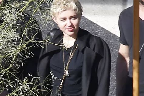 Miley Cyrus Continues To Ignore Sex Tape Scandal As She Attends