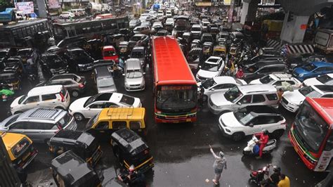 In Photos Mumbai Witnesses Heavy Rains Waterlogging And Traffic