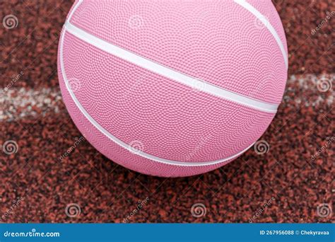 Pink Basketball Ball On The Ground Close Up Ball On The Red Court