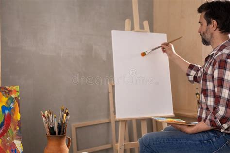 Male Artist Working On Painting Man Artist Painter In Creative Studio