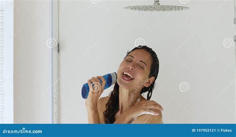 Woman Using Gel Bottle Like Microphone Singing While Take Shower Stock