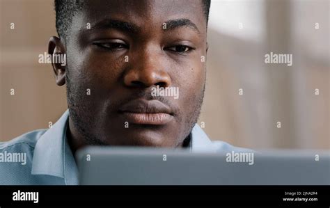 Serious Male Young African American Businessman Programmer Typing On