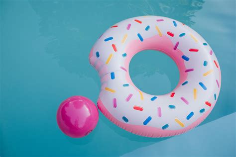 Pink Flamingo Inflatable Ring and Green Inflatable Ring on Swimming ...