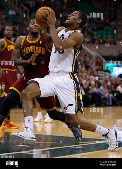 Utah Jazz S Alec Burks Right Drives Past Cleveland Cavalier S Kyrie