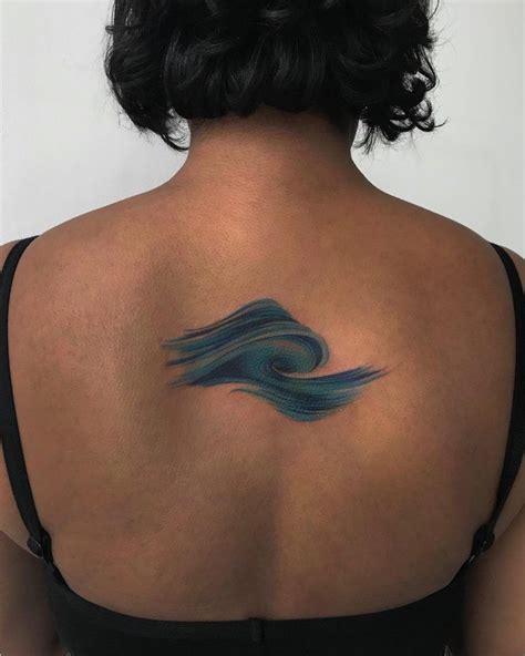 Abstract Sea Wave Tattoo On The Upper Back