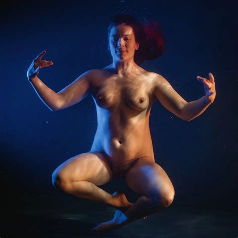 Naked Lady Posing A Yoga Pose Totally Naked Inside A Swimming Pool
