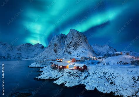 Aurora Borealis, Lofoten islands, Norway. View on the houses in the Hamnoy village, Lofoten ...