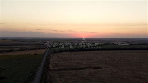 Aerial View Of Rural Road Passing Through Agricultural Land And