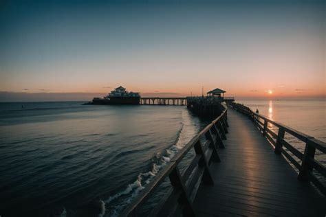 Premium AI Image | Detail of a seaside boardwalk at sunset