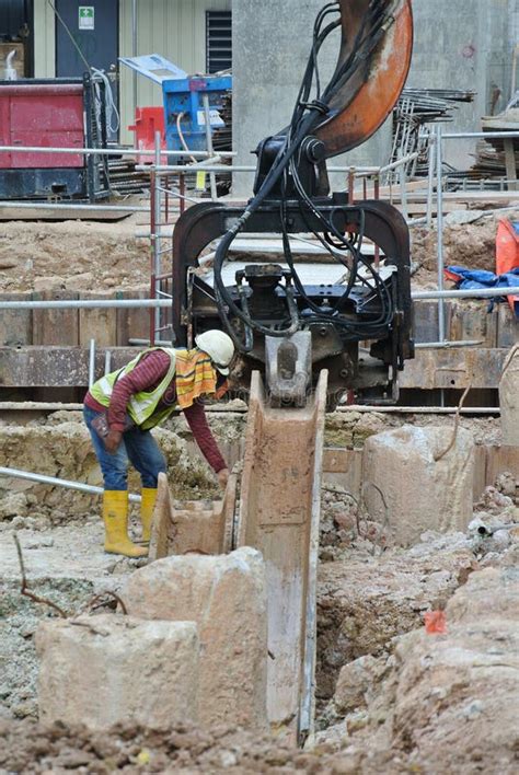 Steel Sheet Pile Cofferdam Machine At The Construction Site Stock