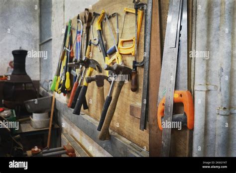 Tools Hanging On Rack In Workshop Stock Photo Alamy
