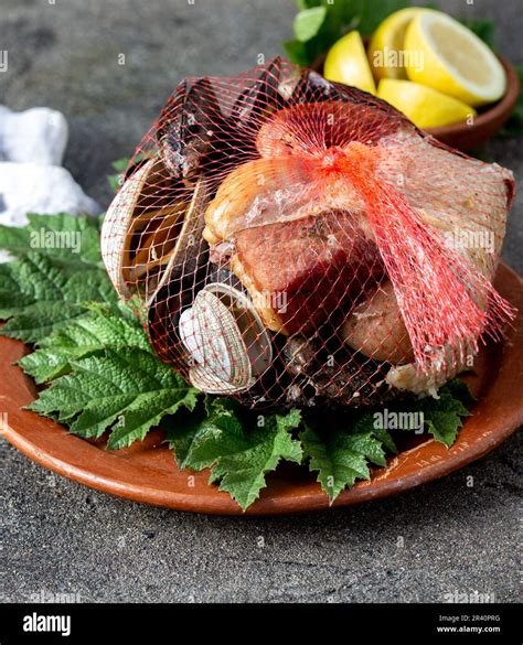 Famous traditional dish of the south of Chile and the Chiloe archipelago - Curanto al Hoyo ...