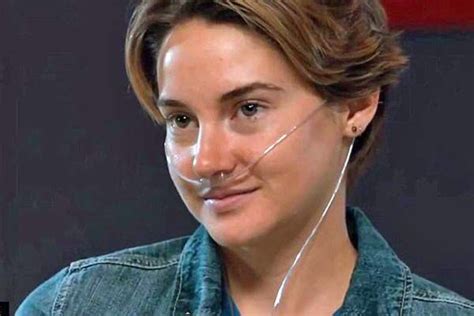 A Woman With Ear Buds On Her Ears And Nose Is Looking At The Camera While Wearing Headphones