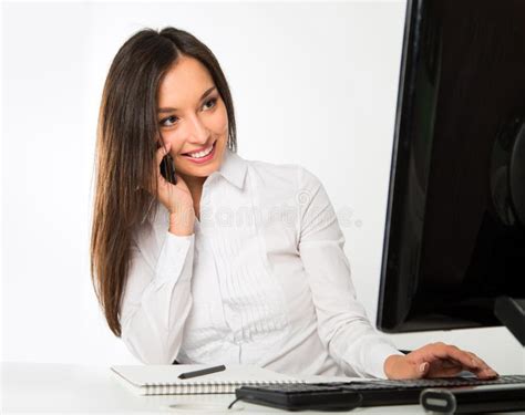 Portrait Of A Young Business Woman Using Computer At Office Stock Image