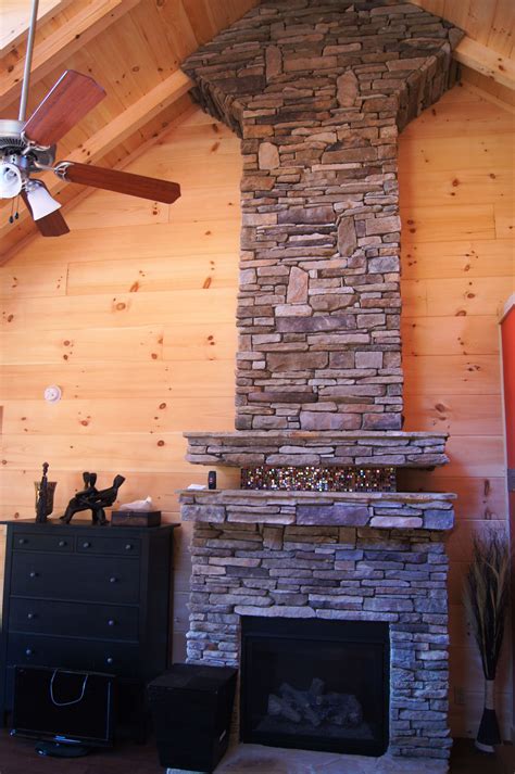 Amazing rock ceiling high fireplace with mosaic tile | Fireplace, Log ...