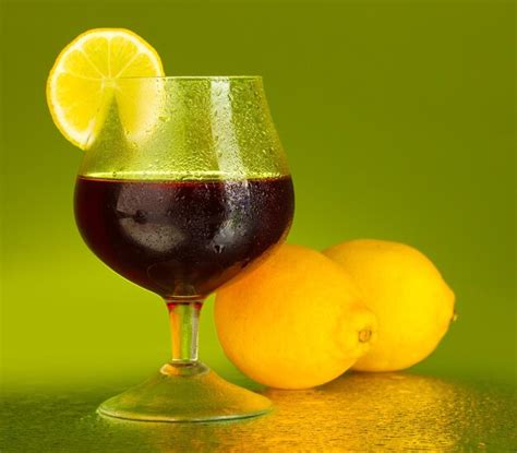 premium photo glass  brandy  green background closeup