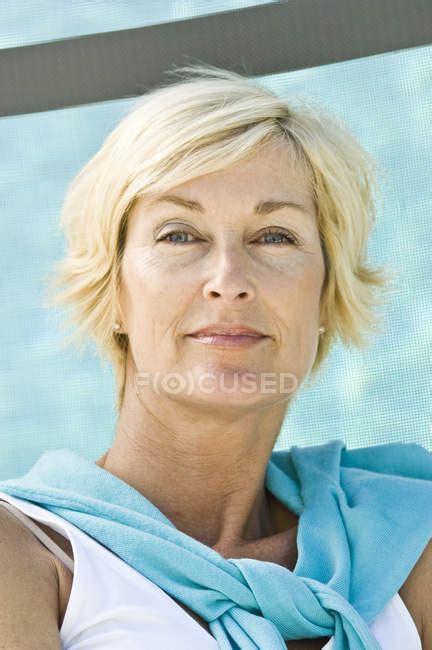 Portrait Of Mature Blond Confident Woman With Short Hair Proud