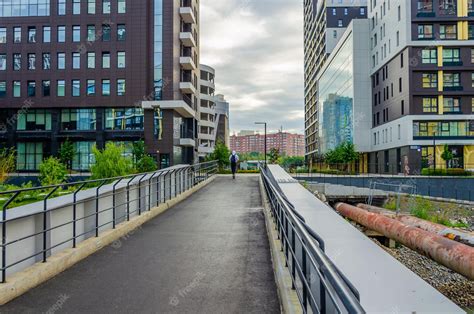 Premium Photo | A pedestrian bridge with a man walking on it