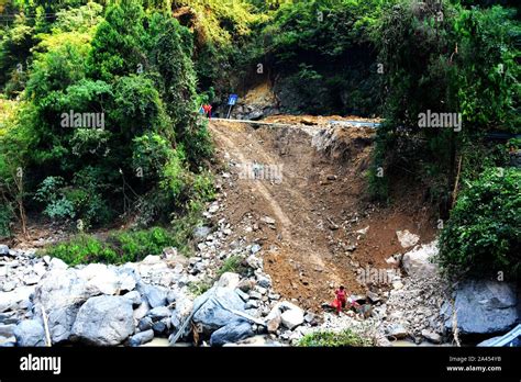 Chinese Workers Reconstruct A Road Devastated By Floodwater After Heavy