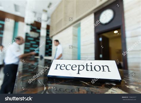 Hotel Reception Desk With A Table And Receptionists On A Background