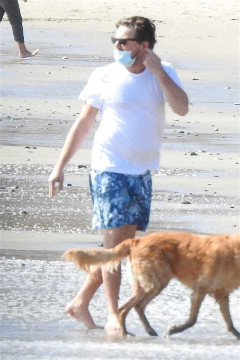 Leonardo DiCaprio in a White Tee Was Seen on the Beach in Malibu 03/29