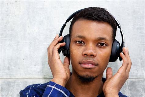 Handsome Black Man Listening To Music With Headphones Stock Image