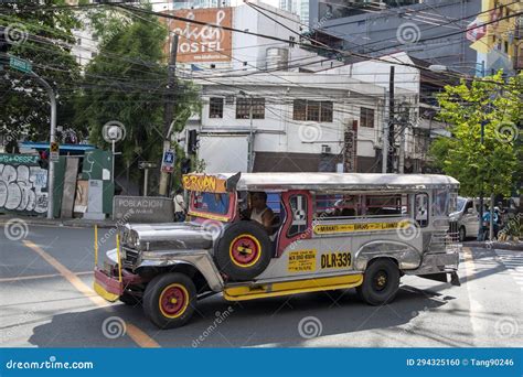 Jeepney Taxi Drives Down The Road In Downtown Manila Editorial Image