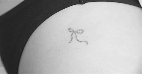 Fine Line Style Bow Tattoo Placed On The Hip
