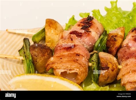 Bacon Wrapped Grilled Scallops With Mushrooms And Bacon Stock Photo Alamy