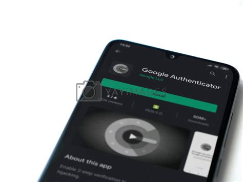 Google Authenticator app play store page on the display of a bla by ... 
