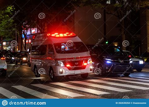 Ambulance With Flashing Red Lights In Heavy Traffic At Night Editorial