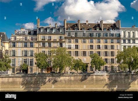 Elegant Apartment Buildings With White Wooden Shutters Overlooking The
