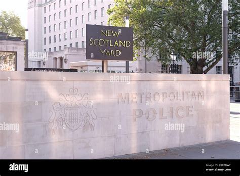 London Uk The Rotating Sign And Front Wall Of The Metropolitan Police