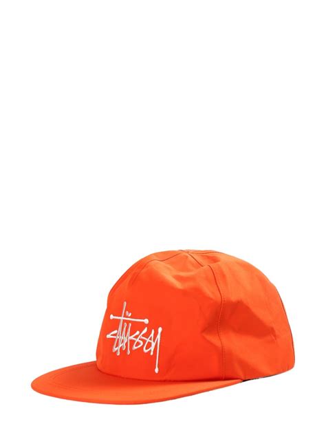 Stüssy logo embroidered Cap オレンジ FARFETCH JP