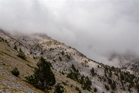 Anoramic View Of The Cloud Covered Slopes And Rocky Ridges Of Mount