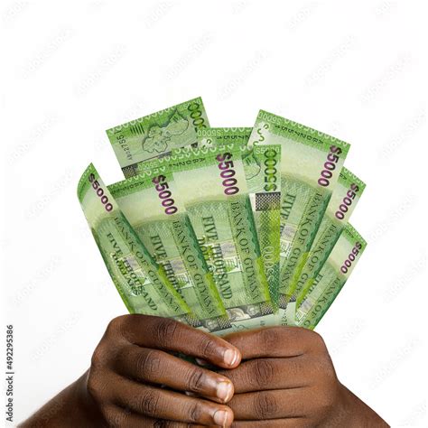 Black Hands Holding 3D Rendered 5000 Guyanese Dollar Notes Closeup Of