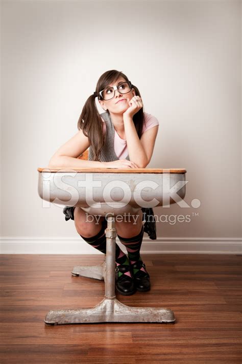 Bored Nerdy Young Woman Student Sitting In School Desk Stock Photo