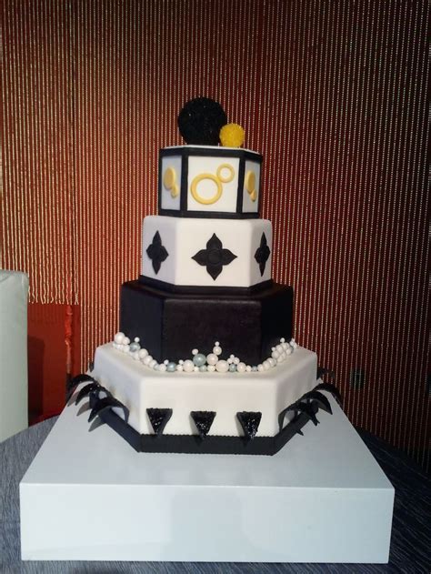 Display wedding cake, black fondant details are awesome on a wedding cake, along with metallic ...