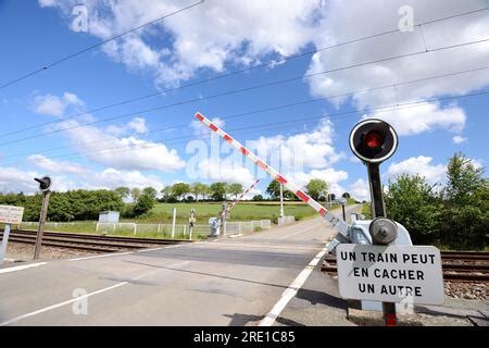 Closing Barriers At The Level Crossing Stock Photo Alamy