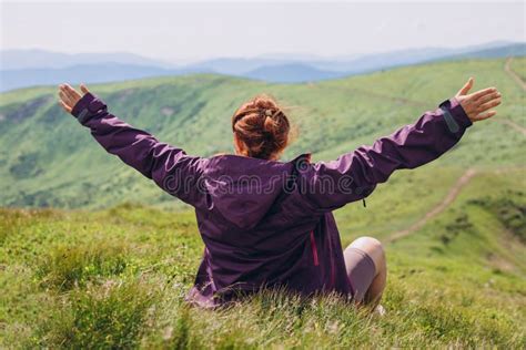 Hiker Woman Siting On The Grass With Hands Up Achieving The Top Young